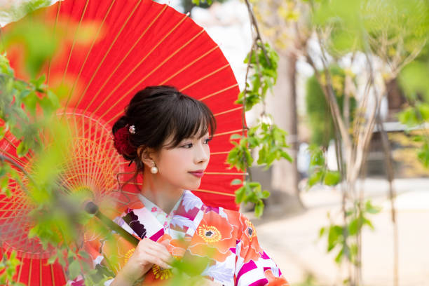 istock Young asian girl wearing kimono (Japanese traditional clothes). 1048650590