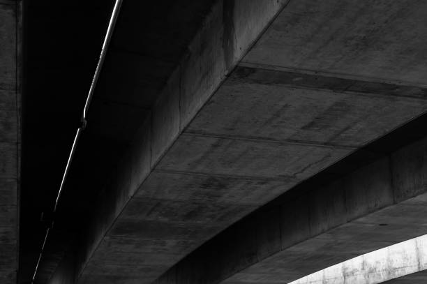 istock Concrete beams that support an overpass on an urban road 1048653598