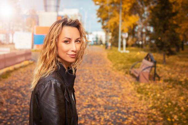 istock The girl walks through the autumn park 1048657146