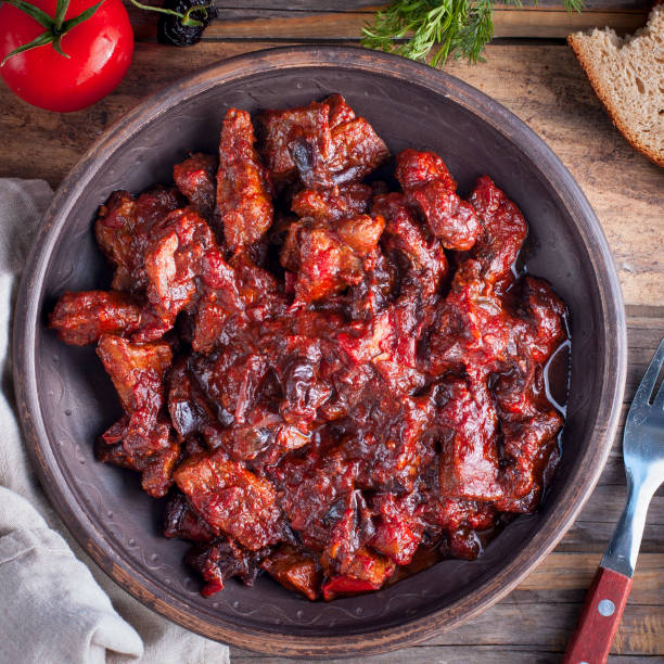 istock Meat with tomatoes and prunes, top view, selective focus 1048660422