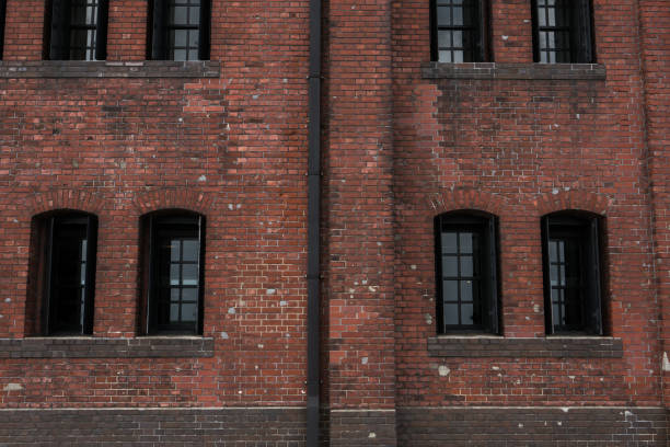 istock Old building style decorated by red block wall as contemporary design 1048664262