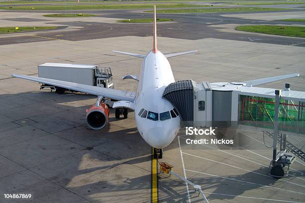 Aircraft On Stand At Gatwick Airport England Stock Photo - Download Image Now - Light Goods Vehicle, Airport, Airplane