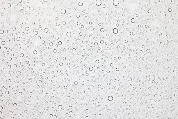 istock Rain droplets on glass background, Water drops on glass. 1048684258