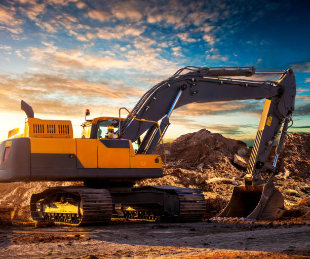 istock Tracked excavator at the construction site in the evening. 1048686876