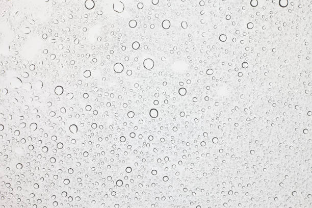 istock Rain droplets on glass background, Water drops on glass. 1048686994