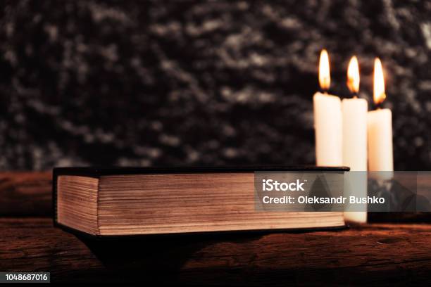 4 Burning Candles With Dripping Wax On Vintage Hard Cover Books #2  Photograph by Dorin Puha - Pixels