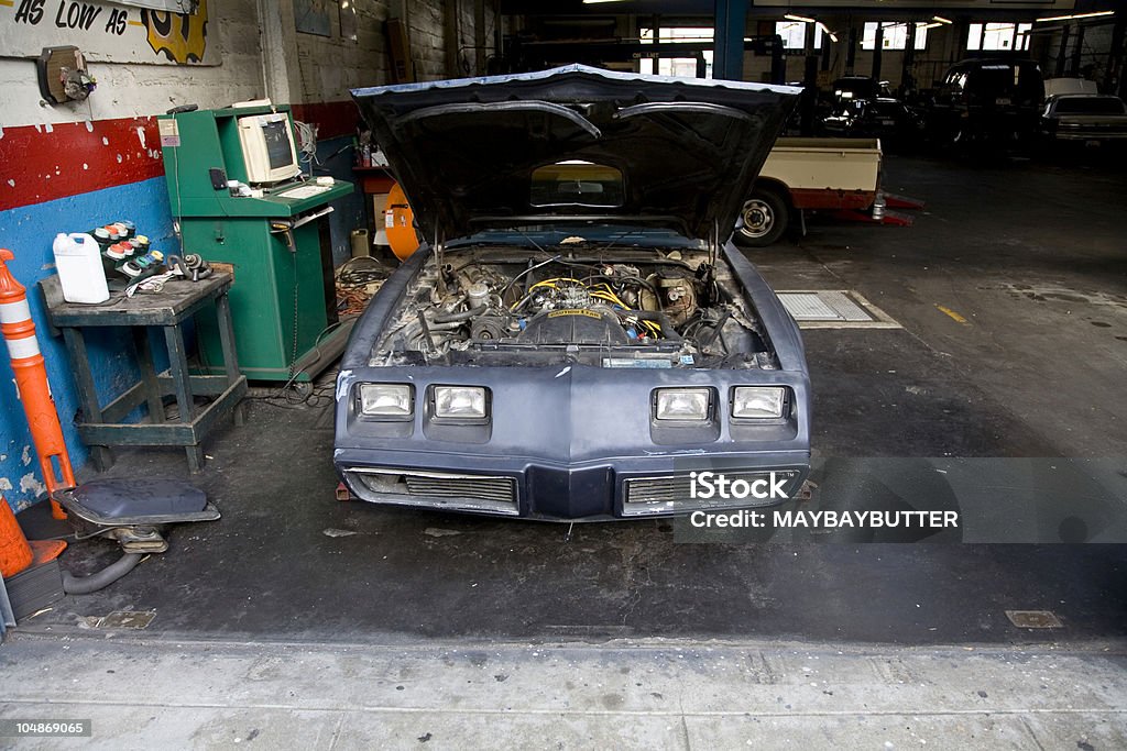 Fix Car being repaired Auto Repair Shop Stock Photo