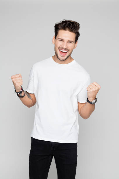 istock Cheerful young man celebrating success 1048695822