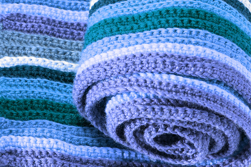 Close-up of a woolen knitted scarf (rolled)