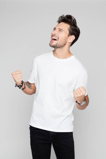 istock Excited young man celebrating success 1048695988