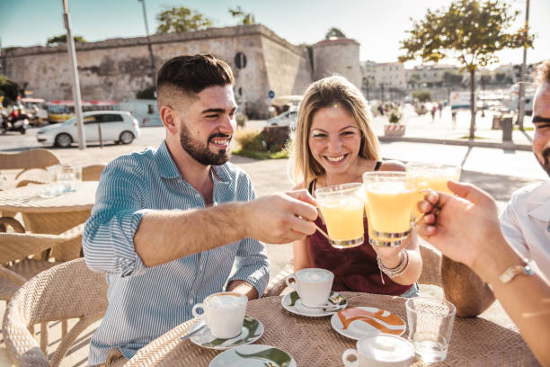 istock friends toasting at the cafe for a celebration 1048698648