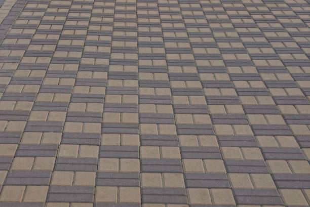 istock brown stone texture of pavement on the road 1048699054