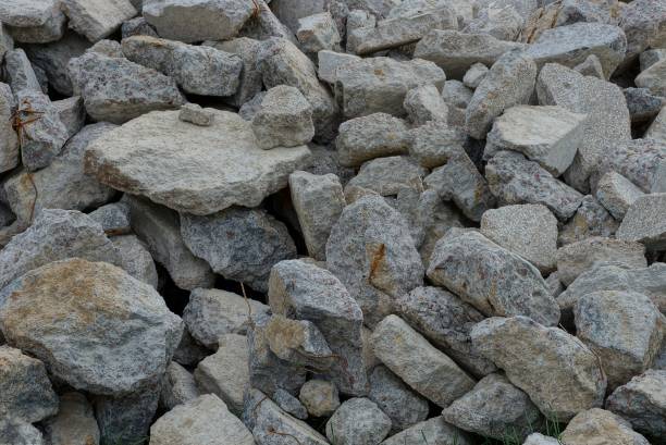 istock gray texture from a pile of large stones 1048699116