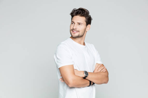 istock Handsome man standing with his arms crossed 1048699180