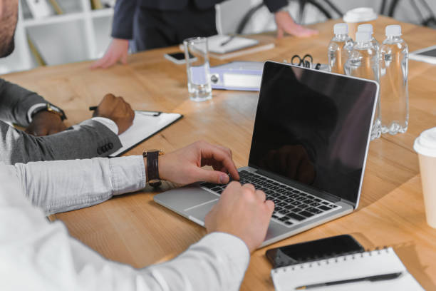 istock cropped image of multicultural businesspeople at meeting 1048701596