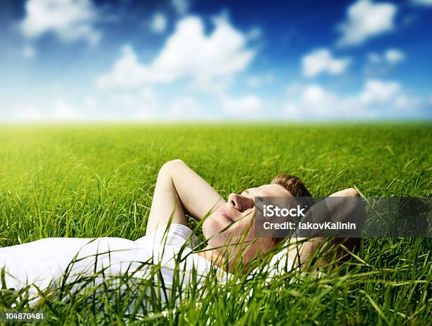 Young Man Laying On Green Grass With Eyes Closed Stock Photo - Download Image Now - Adult, Adults Only, Agricultural Field