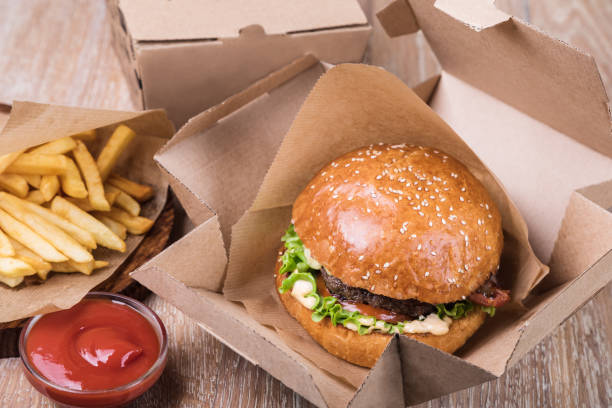 istock Burger on a wooden board 1048706732