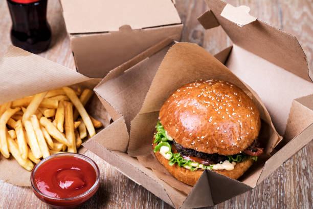 istock Burger on a wooden board 1048706982