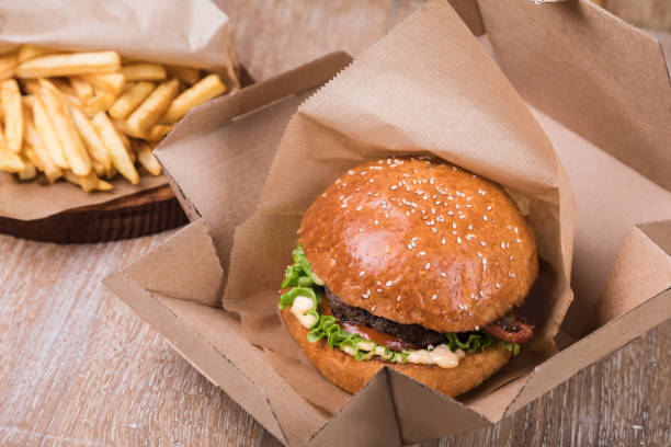 istock Burger on a wooden board 1048707352