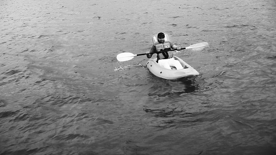 Young Indian man boating in Mandovi river in Goa/India. The Mahadayi/Mandovi River, also known as Mahadayi or Mhadei river, is described as the lifeline of the Indian state of Goa. The Mandovi and the Zuari are the two primary rivers in the state of Goa. Mandovi joins with the Zuari at a common creek at Cabo Aguada, forming the Mormugao harbour.