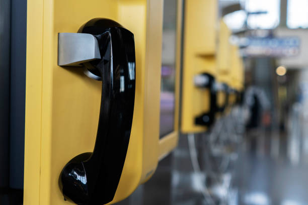 public telephone booth in airport terminal