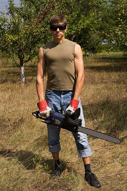 Man with chainsaw stock photo