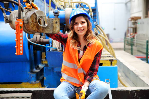 istock Young woman working in factory 1048712348