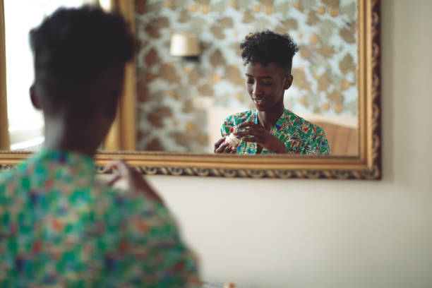 istock Young woman applying a moisturizer in the morning 1048720844