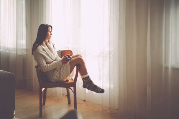 istock Young woman at home 1048721424