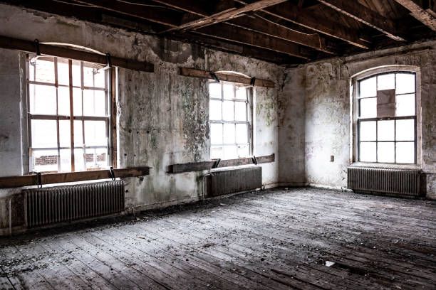istock Abandoned school building interior with damaged floors and ceilings 1048725898