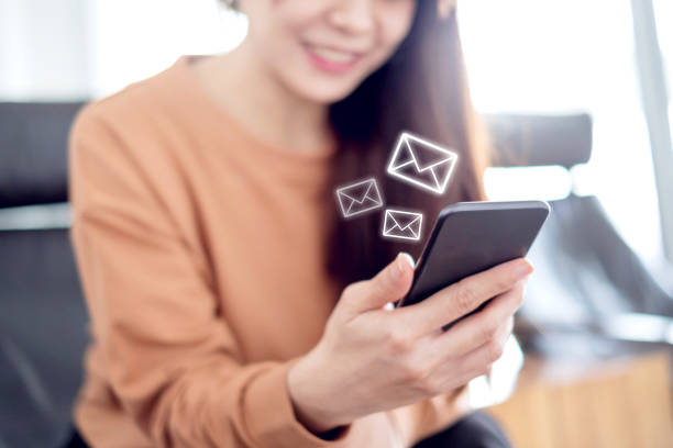 istock Closeup Woman hand using mobile smartphone with email icon, Email concept. 1048735554