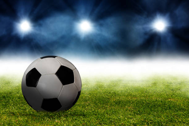 istock Traditional soccer ball on soccer field 1048736712