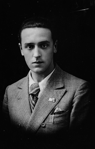 1930s 1940s 1950s Studio shot of a young elegant suit dressed italian man