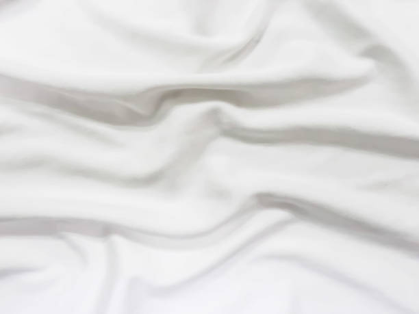 istock wave of white fabric for abstract background 1048744418