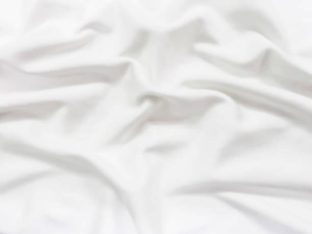 istock wave of white fabric for abstract background 1048744510