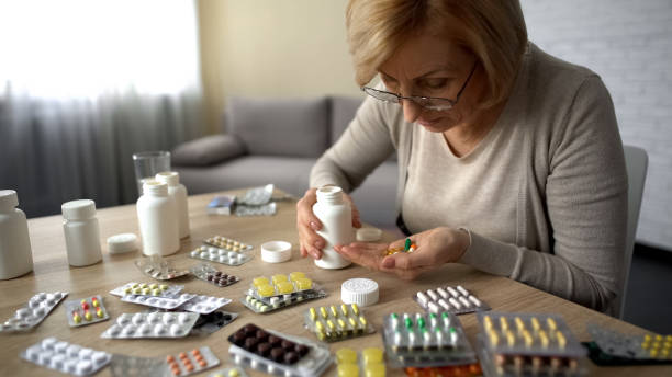 istock Senior lady taking too much pills, feeling unwell, heart problem self-medication 1048744682