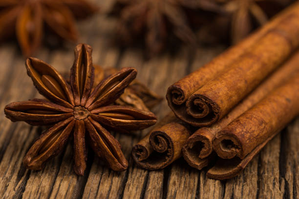 istock Star anise and cinnamon on old wooden table. Selective focus. 1048745664