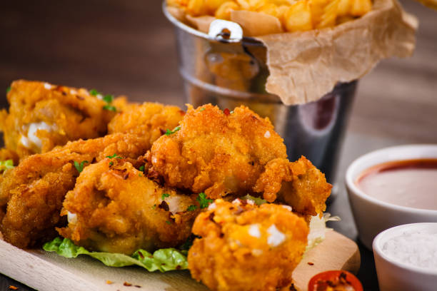 istock Chicken nuggets and French fries 1048756480