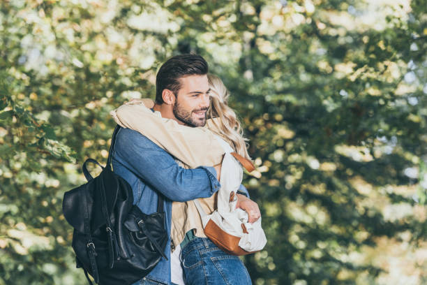 istock side view of romantic couple hugging in autumn park 1048759882