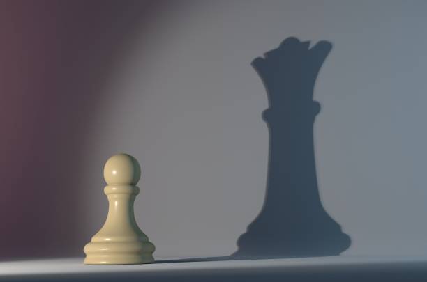 istock Pawn Chess Piece with the Shadow of a Queen 1048764168