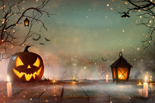 istock Halloween pumpkins on old wooden planks. 1048764526