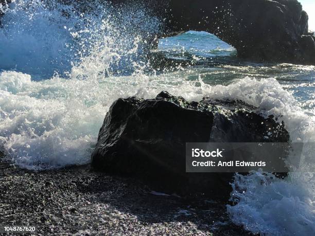 Ocean Waves Crashing Over Black Volcanic Rock And Sand La Palma Island Canary Islands Spain Stock Photo - Download Image Now