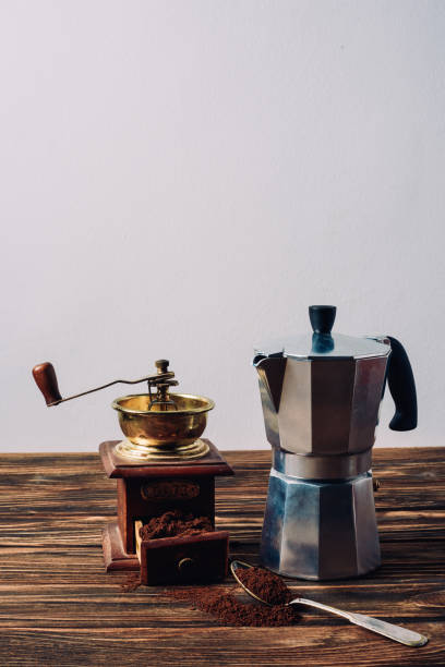 istock mocha pot and vintage coffee grinder on rustic wooden table 1048770744