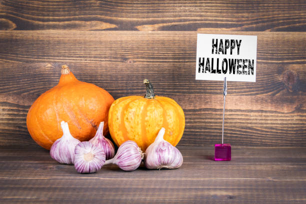 istock Happy Halloween, pumpkins and garlic 1048770844