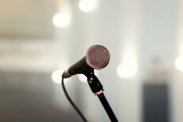 istock A microphone on stage in a concert hall or american bar (restaurant) during a show. 1048775004