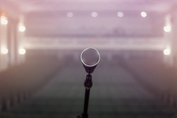 istock A microphone on stage in a concert hall or american bar (restaurant) during a show. 1048775026