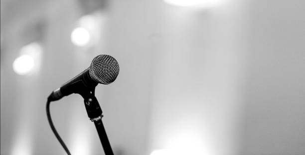 istock A microphone on stage in a concert hall or american bar (restaurant) during a show. 1048775072
