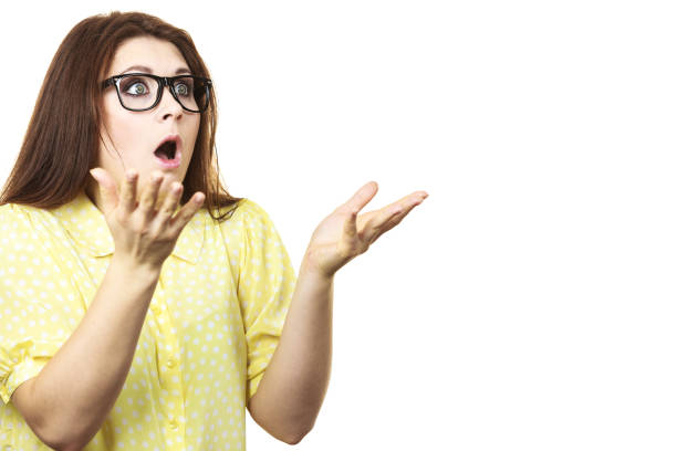 istock Shocked amazed woman gesturing with hands 1048779632