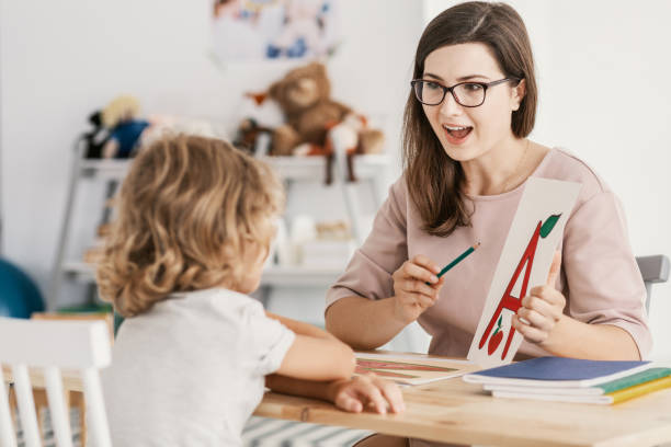 istock A young child development therapist  working with a child to overcome his problems 1048781734