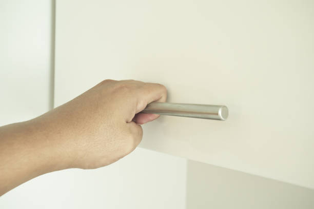 istock Man hand open the wood box or cabinet door 1048783878